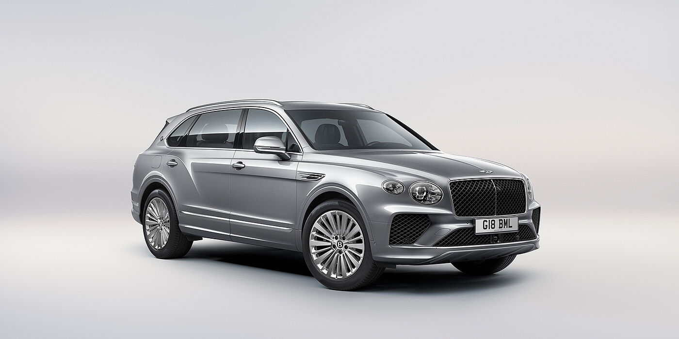 Bentley Birmingham Bentley Bentayga Extended Wheelbase luxury SUV front three quarter view in Moonbeam paint with 21 inch five spoke painted wheels