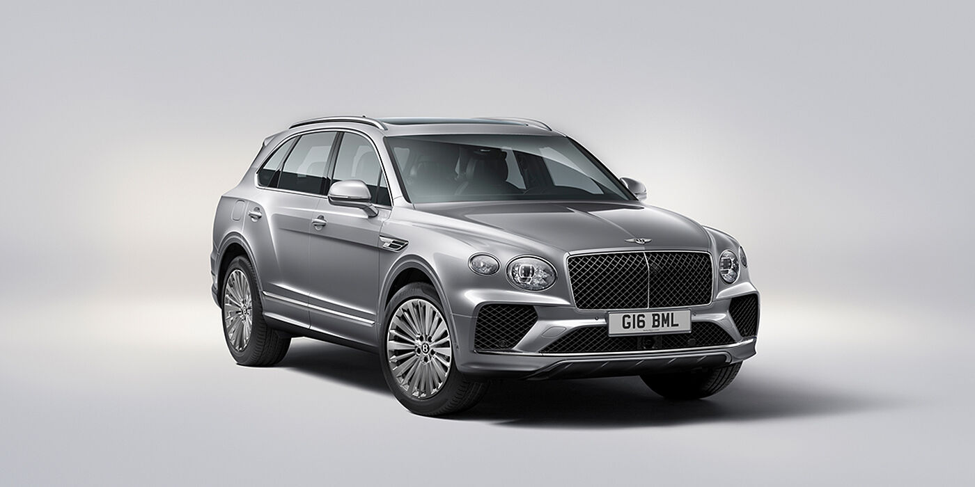 Bentley Birmingham Bentley Bentayga luxury SUV front three quarter view in Moonbeam paint with matrix grille and 21″ 5 spoke painted wheels