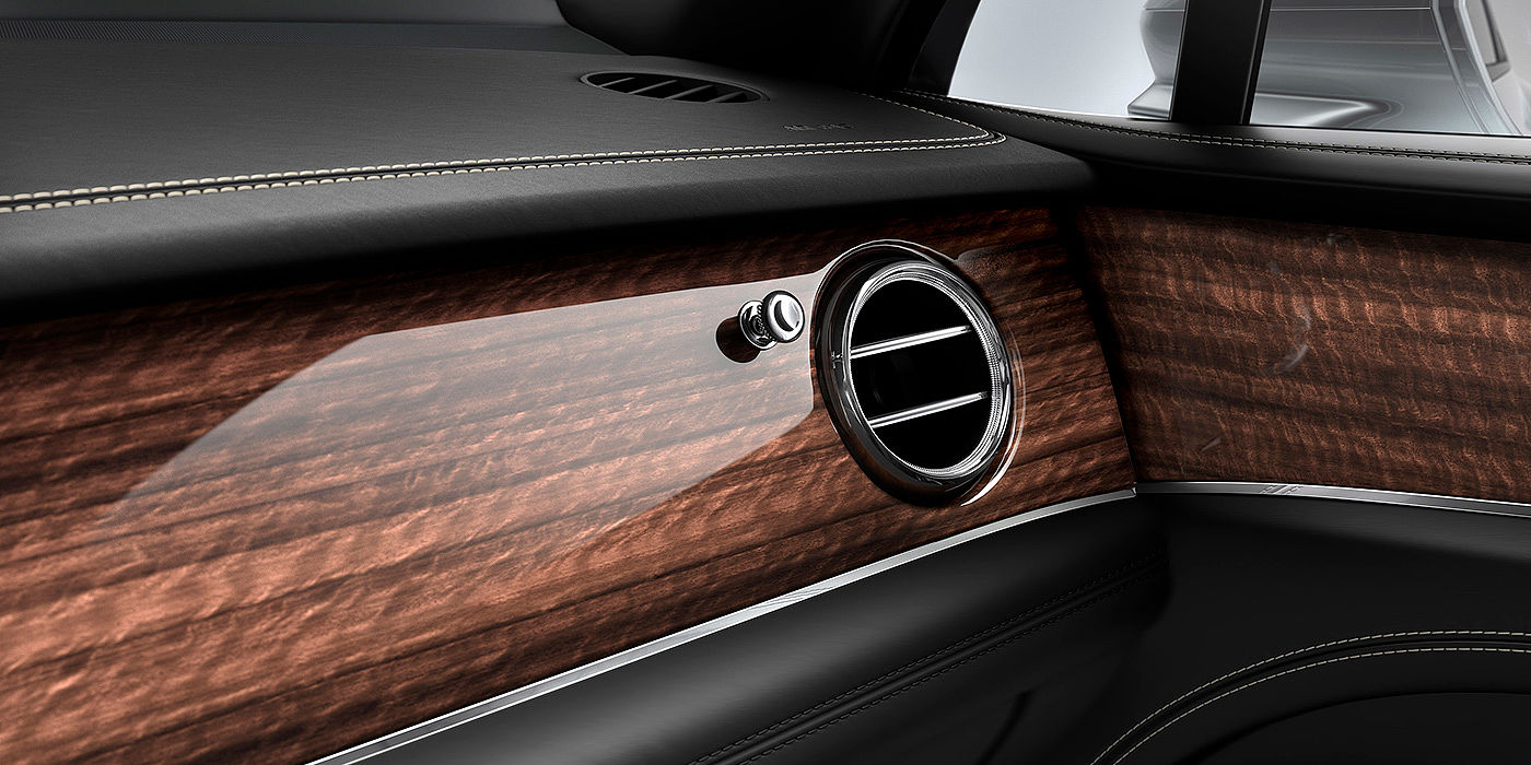 Bentley Birmingham Bentley Bentayga front interior Crown Cut Walnut veneer and chrome air vent.