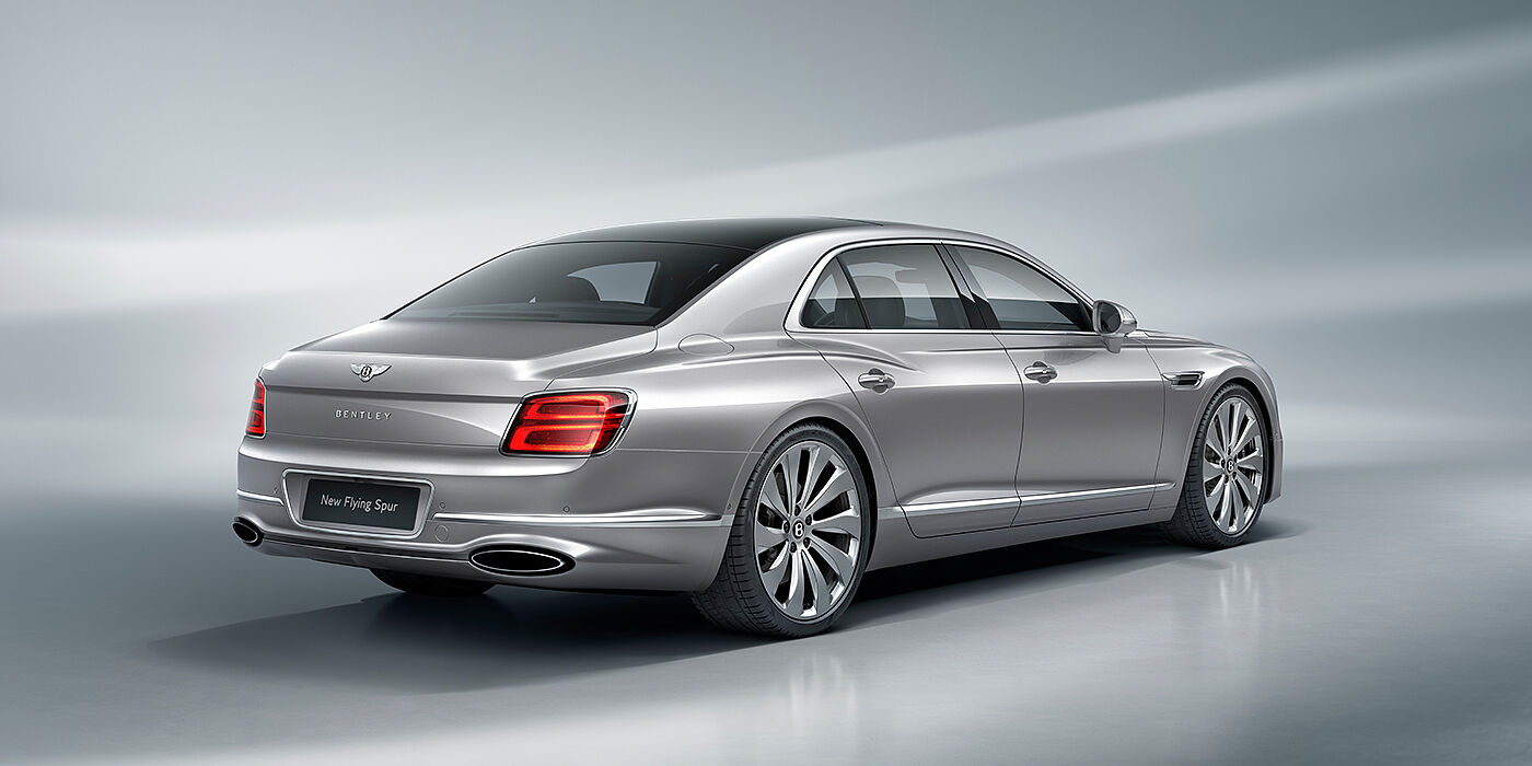 Bentley Birmingham New Bentley Flying Spur sedan rear view in Silverlake paint with ten spoke wheels and chrome matrix grille