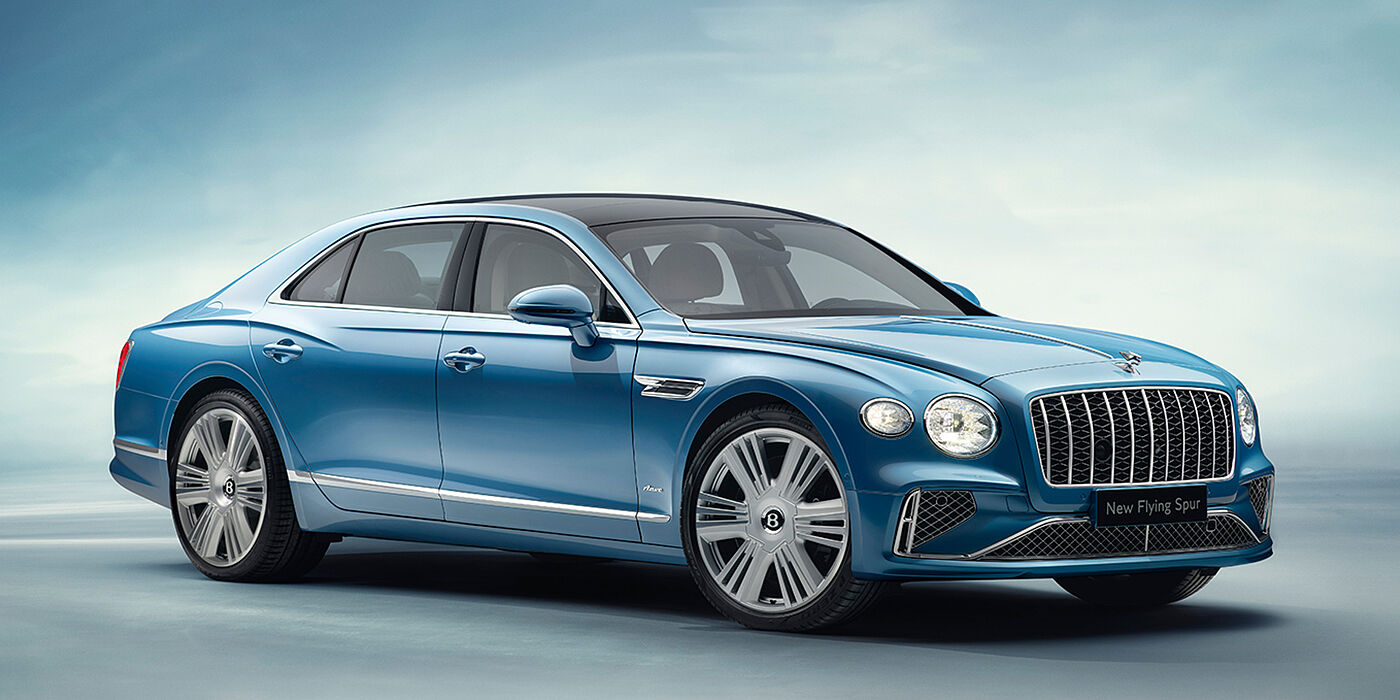 Bentley Birmingham New Bentley Flying Spur Azure sedan front view in Light windsor blue by Mulliner paint with 22 inch Azure wheels and chrome exterior details