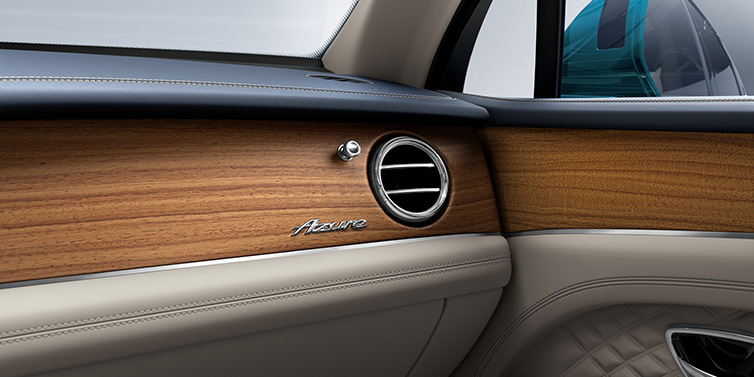 Bentley Birmingham Bentley Bentayga Extended Wheelbase Azure front dash showing Open Pore Koa veneer surrounded by Portland and Imperial Blue hides