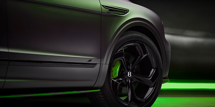 Bentley Birmingham Bentley Bentayga S Black Edition SUV exterior wheel detail with Cyber Green brakes with Anthracite Satin paint