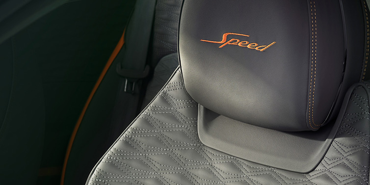 Bentley Birmingham Bentley Continental GT Speed coupe seat detail in Gravity Grey hide and Speed emblem in Mandarin by Mulliner coloured embroidery